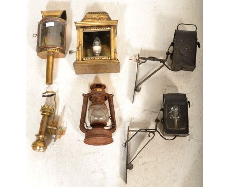 A collection of old vintage 19th and 20th century lamps to include brass cased with WR monogram, brass carriage light with VR