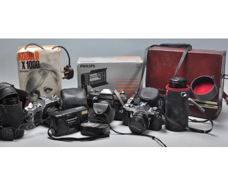 A mixed group of vintage 20th Century photographic and film cameras to include a cased Bell &amp; Howell Autoload 1216, boxed