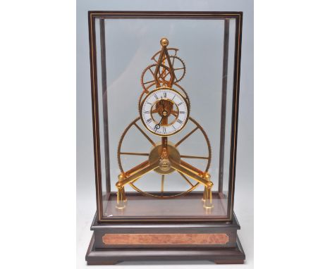 Shandong Compas Clocks &amp; Watches Co - A fantastic contemporary glass cased, 24k gold coated 8 Day Big Wheel Skeleton Cloc