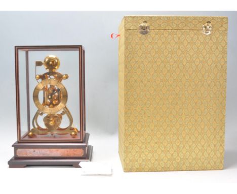Shandong Compas Clocks &amp; Watches Co - A stunning contemporary glass cased, 24k gold coated 8 Day Passing Strike Fusee Mov