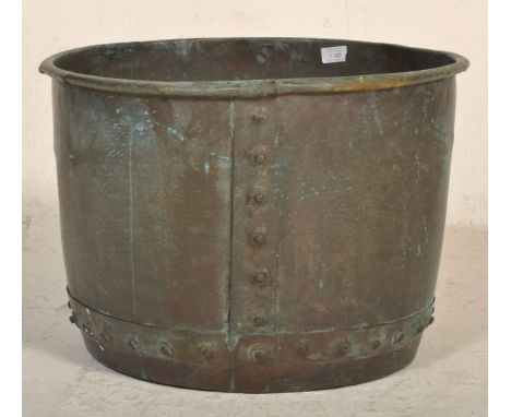 A large 19th Century Victorian copper planter of hammered construction with banding and flared out rim with studded details. 