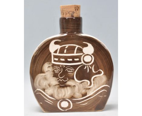 A&nbsp;Rushton Pottery ceramic flask having a brown and white glaze with a with a Viking man to the front. Marks to base. Mea