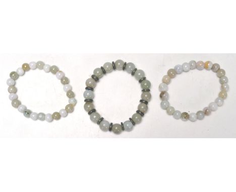 A good group of three vintage Chinese jade bead bracelets, with two similar and one having jade disc spacers.&nbsp; &nbsp;