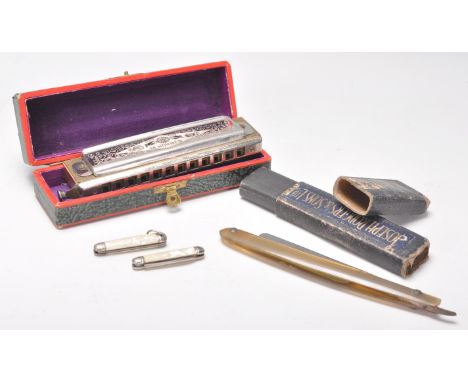 A vintage Hohner Super Chromonica harmonica in its original box together with a Joseph Rogers &amp; Sons boxed razor and two 