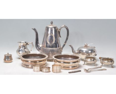 A good mixed group of silverplate and silver items dating from the 19th Century to include three silver hallmarked napkin rin