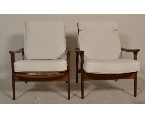 A stunning pair of retro vintage 20th Century Danish&nbsp; teak wood low easy lounge chair / armchairs in the manor of Greave