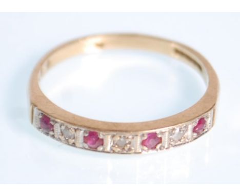 A 9ct gold ruby and diamond ring having seven stone setting of round cut ruby and diamonds.&nbsp;