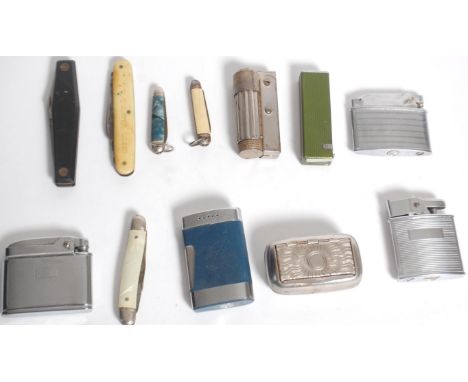 A small group of vintage lighters and penknives to include a Penguin Superlative automatic lighter, boxed Ronson Cadet and on