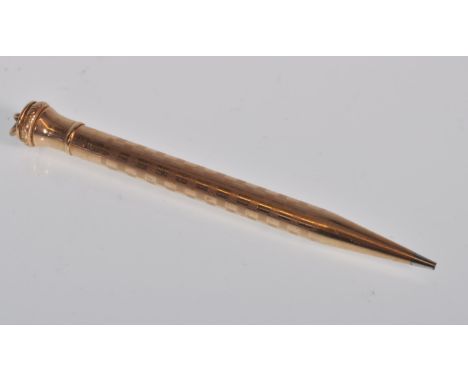 A vintage Wahl Eversharp 9ct gold mechanical pen having engine turned decoration, the top having repousse decoration with a b