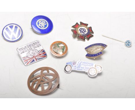 Motoring Related - A small group of vintage enamel pin badges to include 1888 - 1938 Dunlop button badge, British Motor Racin