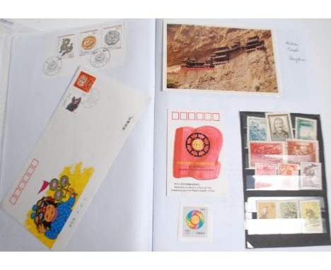 A collection of 3 stamp and postcard albums to include China with stamps, covers, postcards and ephemera. World Stamp Extrava