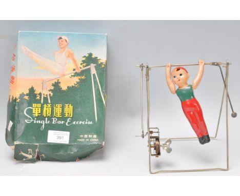 A vintage retro Chinese single bar exercise clock work toy, complete in its original box.&nbsp;