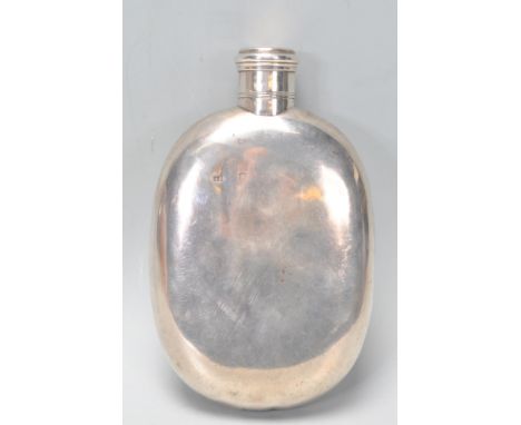 A good large vintage 20th Century silver hallmarked hip flask of simple form having a screw cover. Marks rubbed with marks to