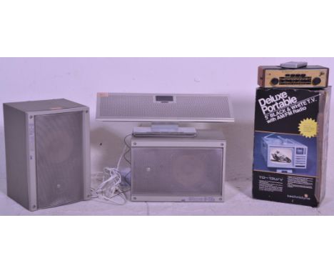 A group of music players / radios to include a Technika Wireless Stereo Speaker System, a Roberts R757 3-Band Radio AM-FM, De