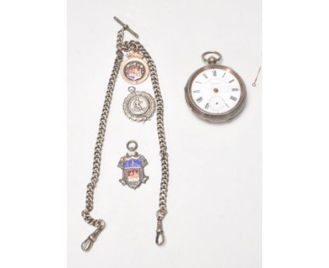 A late 19th Century Victorian silver hallmarked open face pocket watch having a white enamel face with Roman numeral chapter 