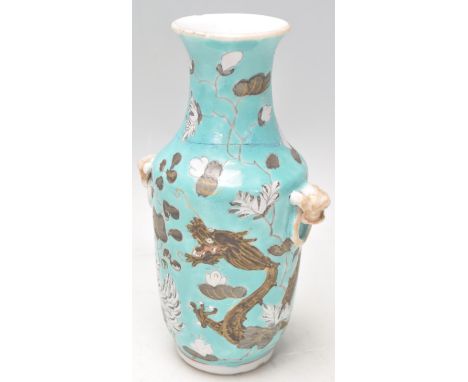 A small early 20th Century Chinese Dayazai vase having a light blue ground decorated with a painted dragon with four toes, fl