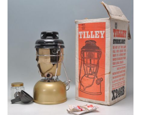 A new and unused Vintage Tilley lamp and accessories in gold enamel colourway being complete with the original box etc