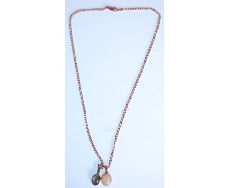 A 9ct gold figaro link necklace chain adorned with 2 opal necklace pendants. The champed 375. Length 42 cm / total weight 9g.
