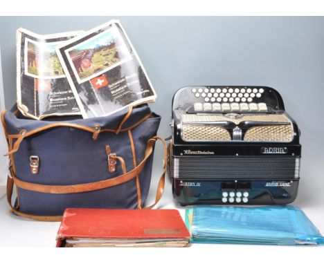 A vintage 20th Century Adria made&nbsp;accordion, model Diaton IV Grand Luxe finished in black with lucite keys and leather s
