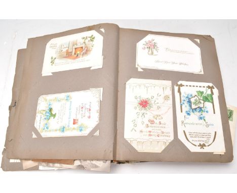 A vintage 20th Century postcard album containing a wide selection of postcards dating from the 19th Century of various subjec