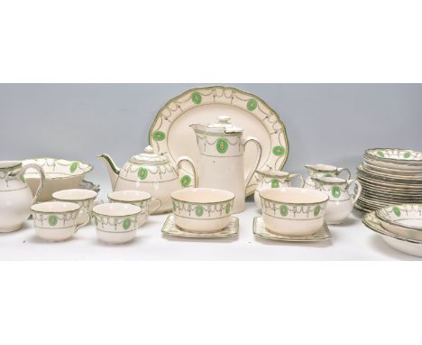 An early 20th Century Royal Doulton Countess pattern ceramic tea&nbsp; / dinner service having green garland decoration to th