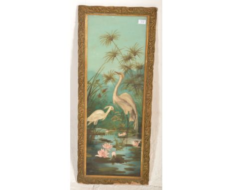 An vintage early / mid 20th century Japanese reverse painted glass panel depicting cranes within a blue lakeside scene. Set w
