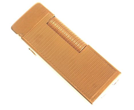 A vintage 20th Century Dunhill roller gas cigarette lighter of rectangular form having a gilt engine turned body. Stamped to 
