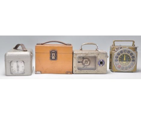 A group of four vintage 20th Century Pigeon clocks to include a Natural Antwerp Junior metal cased clock, Skymaster Ghost hig