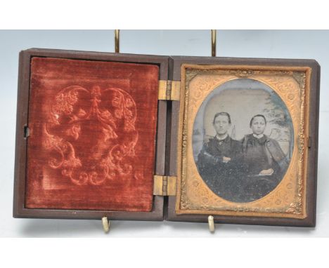 A 19th century Victorian Bois Durci ambrotype photograph frame. The opening large case with inset photograph