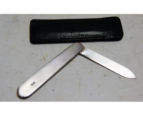 An engine turned silver pocket fruit knife, with leather sleeve