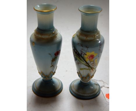 A pair of Royal Worcester porcelain vases, each polychrome decorated with wild flowers, shape No.1726, puce backstamp, h.17cm