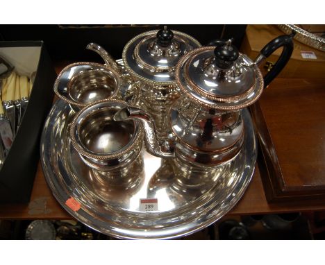 An Old Sheffield plate four-piece tea and coffee service, on circular tray
