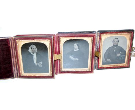 A Victorian daguerreotype depicting three quarter length portrait of a man in seated pose, in fitted leather case; together w