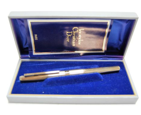 A Christian Dior silver gilt cased fountain pen, No.ABF458, having 14ct gold nib, boxed with instruction booklet