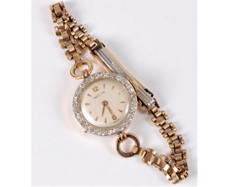 A lady's 18ct and diamond cased Recta wristwatch, the round off-white dial with gilt Arabic quarter hours and baton hours, wi