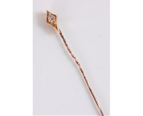 A diamond set stick pin, the old mine cut diamond, estimated approx. 0.16cts, with a diamond highlight above and below, set i