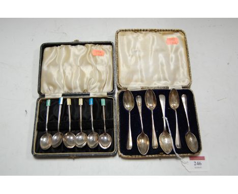 A Harlequin cased set of six silver teaspoons, together with a cased set of six silver and enamel topped coffee spoons (2)