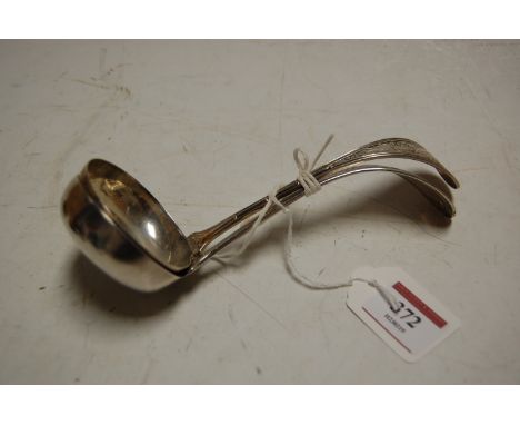 An early 20th century sterling silver ladle, the terminal embossed with a phoenix amongst foliage, stamped to the stem 'JE Ca