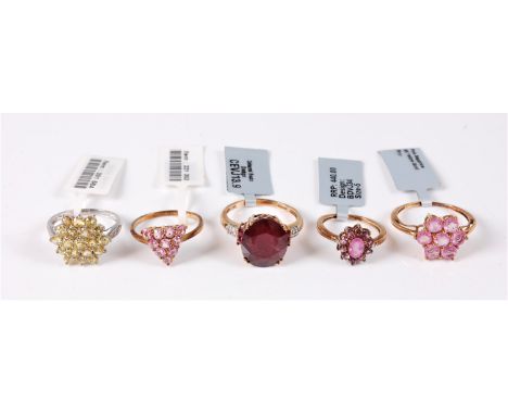 Five 9ct gemset rings, to include a ruby and diamond ring, the oval ruby, approx. 14mm long, set to either side with two smal