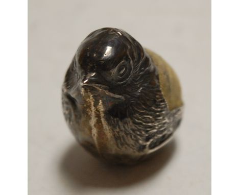 A George V silver novelty pin cushion, in the form of a hatching chick, maker Sampson Morden &amp; Co Ltd, Chester 1914