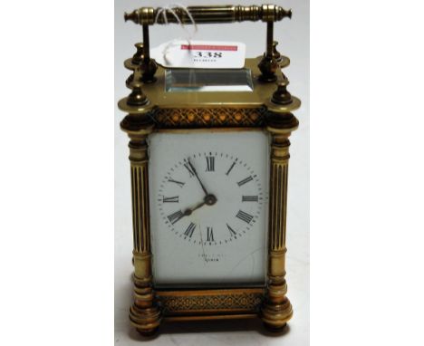 An early 20th century French lacquered brass cased carriage clock, having enamelled dial with Roman numerals, indistinctly si