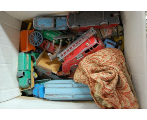 A box of assorted loose and playworn diecast toy vehicles to include Dinky Supertoys fire truck, Dinky Supertoys fire engine,