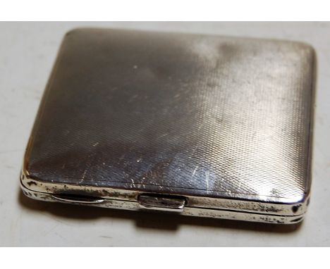 A George V pocket cigarette case, having engine turned decoration, 2.9oz