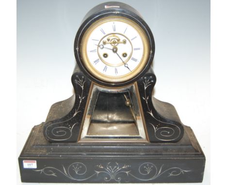 A large late 19th century black slate drum-head mantel clock, having an enamelled chapter ring with Roman numerals, visible e