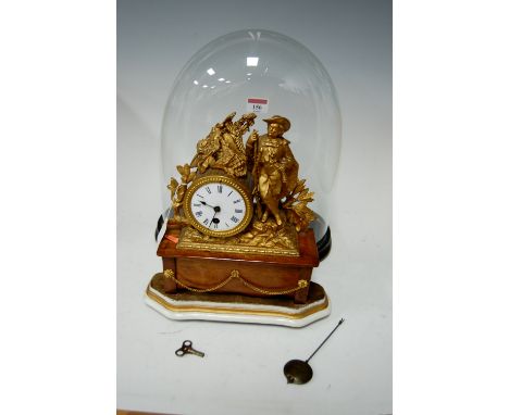 A circa 1900 gilt metal mantel clock under glass dome on ebonised plinth, gross height 39cm