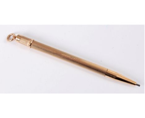 A 9ct gold propelling pencil, the engine turned body with tapered end, and hanging loop, hallmarked Birmingham 1975, 8.6cm lo