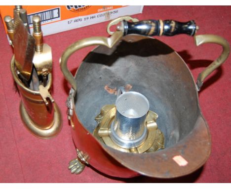 Two 19th century copper warming pans, copper helmet scuttle, brass companion set etc
