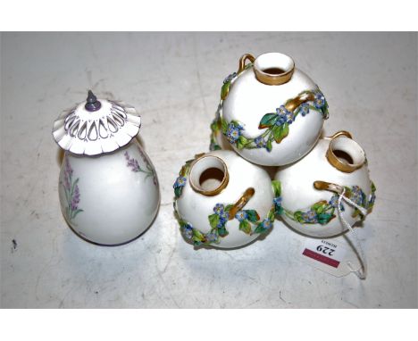 A late Victorian Royal Worcester porcelain four section globular vase, having floral encrusted decoration heightened in gilt,