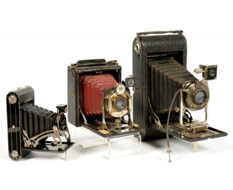 A RAJAR FOLDING QUARTER PLATE CAMERA, A KODAK A122 FOLDING CAMERA AND A KODAK SIX-20 CAMERA 