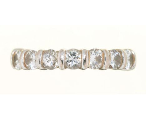 A DIAMOND RING, THE SEVEN SEMI FLUSH SET BRILLIANT CUT DIAMONDS 0.85CT APPROX, J COLOUR, VS2/SI1 CLARITY, TO GOLD HOOP, UNMAR